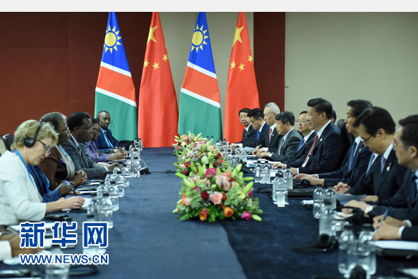 12月4日，國家主席習近平在約翰內斯堡會見納米比亞總統(tǒng)根哥布。 新華社記者 張鐸 攝